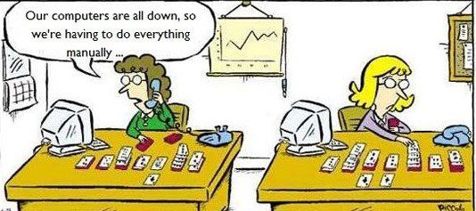 Cartoon of two secretaries playing solitaire on their desks because the Internet is down and they have to do everything by manually.