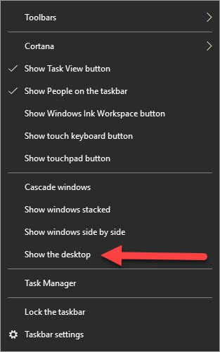 The taskbar right click menu with a red arrow pointing to "Show the desktop"