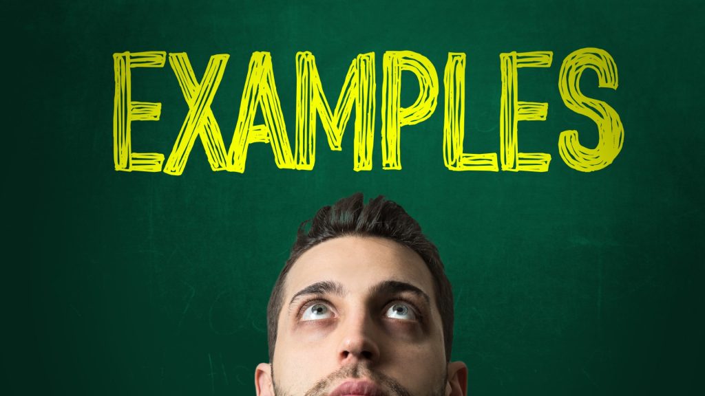 Guy looking up at the word "Examples" in an effort to identify scam email examples.
