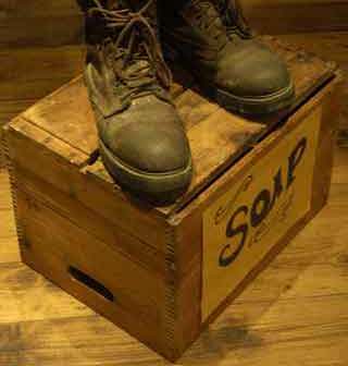 Soapbox with two boots on it
